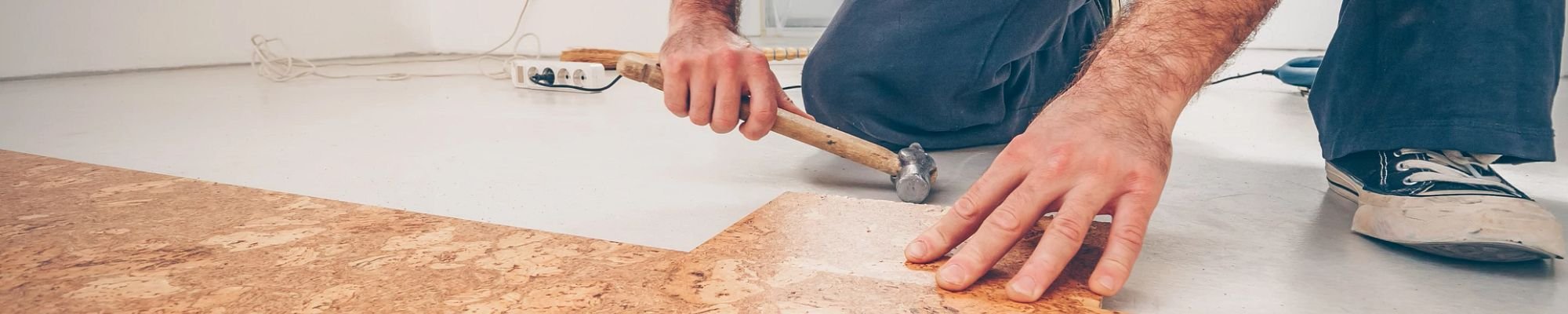 Person installing cork flooring from Scott's Flooring in Barrie, ON