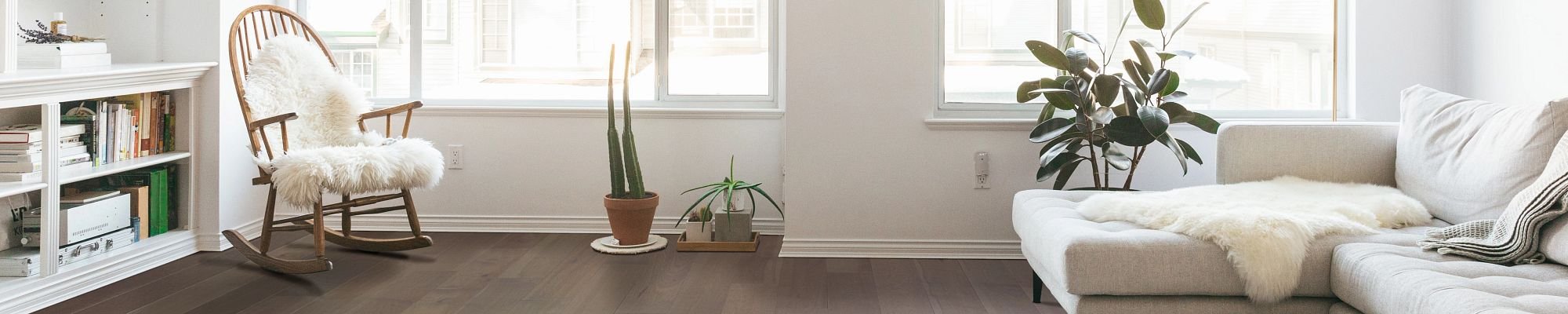 Living room with white furniture and hardwood flooring from Scott's Flooring in Barrie, ON