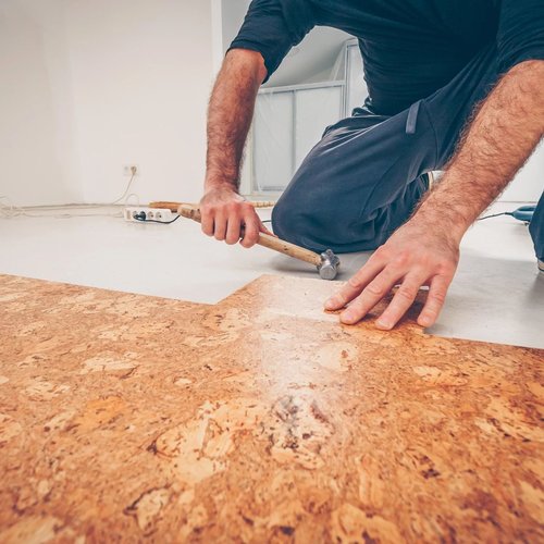 Person installing cork flooring from Scott's Flooring in Barrie, ON
