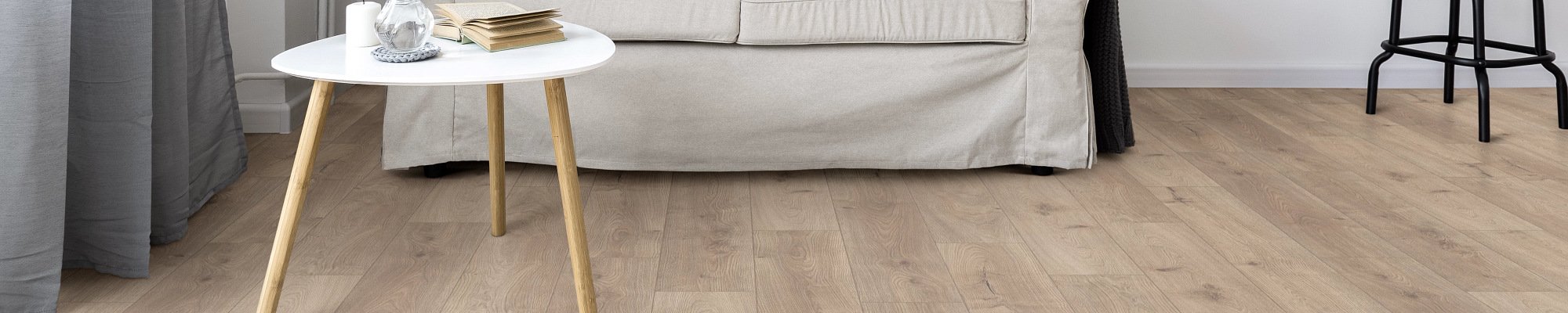 Living room with wood-look laminate flooring from Scott's Flooring in Barrie, ON